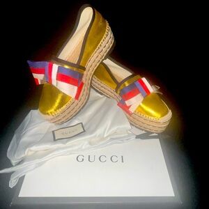 Gucci women's gold metallic leather platform/wedge with red, white and blue bow